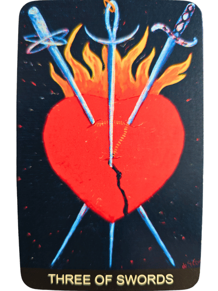 A Tarot de St. Croix card titled Three of Swords shows a red heart pierced by three swords, with flames rising from the heart and a dark background.