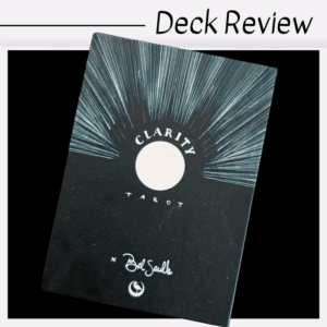 A black Clarity Tarot deck box, featuring radiant white lines and a central white circle, designed by Bel Saulle, is shown under the heading “Deck Review.”.