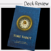 A blue Time Tarot deck box features a clock face with an eye at its center. The authors, Eugene Vinitski and Elsa Khapatnukovski, are listed below the title. Deck Review is printed above.
