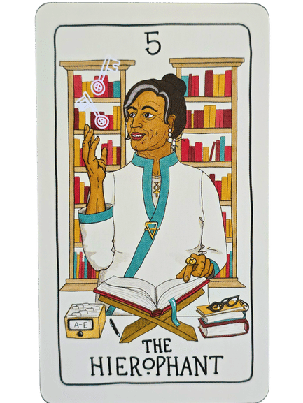 A tarot card from the Fifth Spirit Tarot titled The Hierophant shows a woman in white and teal robes, seated in front of bookshelves. She gestures with one hand, an open book before her amid stacks of books and files.
