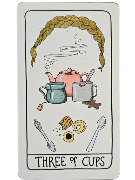 A tarot card from the Fifth Spirit Tarot labeled Three of Cups features a braid at the top, a steaming teapot, mugs, spilled cocoa, pastries, and two spoons, symbolizing a cozy gathering and shared treats.
