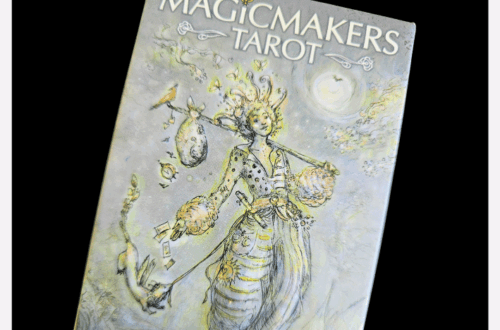 A box of MagicMakers Tarot by Paulina Fae features whimsical, pastel artwork of a mystical figure holding various objects. The image is overlaid with the text “Deck Review” at the top.