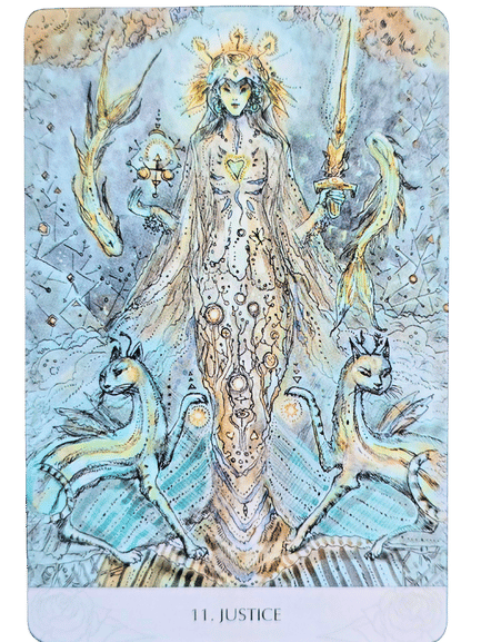 An ethereal figure in a flowing gown stands between two blue mythical creatures, holding a sword and scales, with a glowing crown above her head. The card is labeled 11. Justice from the Magicmakers Tarot.