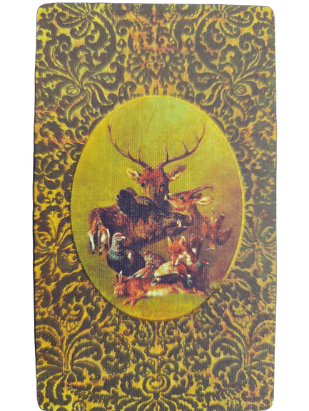 A decorative card with a gold and brown ornate pattern, featuring an oval image in the center showing various animals—stag, fox, hare, bird, and squirrel—arranged together in the enchanting style of the Folkloric Forest Tarot.