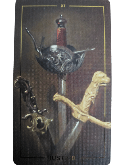 A Folkloric Forest Tarot card labeled XI shows three swords with ornate hilts pointing downward. The word JUSTICE is partially visible at the bottom, set against a dark, textured background.